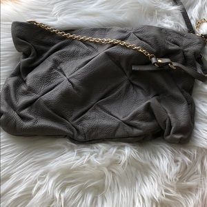 Gray purse with gold straps